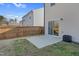 A backyard featuring a concrete patio, wood fence, and grass at 3413 Dragonfly River Ct, Raleigh, NC 27604