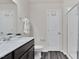 Bathroom features a modern vanity, new hardware, and glass enclosed shower at 3413 Dragonfly River Ct, Raleigh, NC 27604