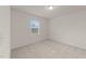 Bright bedroom featuring neutral carpet, light walls, and a window for natural light at 3413 Dragonfly River Ct, Raleigh, NC 27604