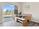 Bright breakfast nook features a wooden table and bench seating next to sliding glass doors leading to the backyard at 3413 Dragonfly River Ct, Raleigh, NC 27604