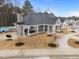 Exterior view of community clubhouse with pool, covered seating, and landscaping at 3413 Dragonfly River Ct, Raleigh, NC 27604