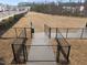 Dog park featuring a secure fence, benches, and pet waste station in a pet-friendly community at 3413 Dragonfly River Ct, Raleigh, NC 27604