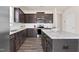 Well-appointed kitchen with granite countertops, stainless steel appliances, and wood flooring at 3413 Dragonfly River Ct, Raleigh, NC 27604