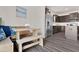Charming breakfast nook adjacent to a modern kitchen with stainless steel appliances and dark wood cabinetry at 3413 Dragonfly River Ct, Raleigh, NC 27604