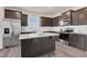 Modern kitchen featuring granite countertops, stainless steel appliances, and a center island at 3413 Dragonfly River Ct, Raleigh, NC 27604