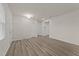 Bright and airy living room with modern flooring and neutral paint at 3413 Dragonfly River Ct, Raleigh, NC 27604