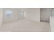 Spacious loft with large windows providing plenty of natural light and soft carpeting at 3413 Dragonfly River Ct, Raleigh, NC 27604