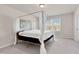 Spacious main bedroom featuring a four-poster bed, window and neutral decor at 3413 Dragonfly River Ct, Raleigh, NC 27604