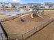 Community playground area featuring a jungle gym with slides, benches, and safety mulch at 3413 Dragonfly River Ct, Raleigh, NC 27604