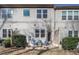 Charming backyard featuring a cozy seating area with blue chairs, perfect for relaxing outdoors at 345 Rubrum Dr, Hillsborough, NC 27278