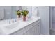 Bathroom featuring double sinks, white cabinets, and stylish fixtures at 345 Rubrum Dr, Hillsborough, NC 27278