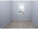 Carpeted bedroom with natural light from one window at 345 Rubrum Dr, Hillsborough, NC 27278
