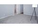 Bedroom featuring plush carpet, natural lighting, and an open bathroom doorway at 345 Rubrum Dr, Hillsborough, NC 27278