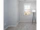 Bright bedroom with a large window, offering natural light and a minimalist design at 345 Rubrum Dr, Hillsborough, NC 27278