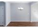 Dining area with hardwood floors, neutral paint, and a chandelier at 345 Rubrum Dr, Hillsborough, NC 27278