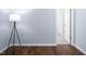Hallway featuring hard wood floors, white baseboards, and an open doorway at 345 Rubrum Dr, Hillsborough, NC 27278