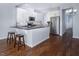 Modern kitchen featuring white cabinets, granite countertops, and stainless steel appliances at 345 Rubrum Dr, Hillsborough, NC 27278