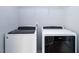 Convenient laundry area with modern, front-loading washer and dryer units, maximizing space and efficiency at 345 Rubrum Dr, Hillsborough, NC 27278