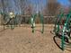 This community playground has a variety of green playground equipment for children to enjoy at 345 Rubrum Dr, Hillsborough, NC 27278