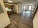 Open kitchen with stainless steel appliances, wood cabinetry, and updated flooring at 3520 Ivy Commons Dr # 302, Raleigh, NC 27606