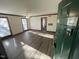 Living room featuring wood-look flooring, neutral walls, a ceiling fan and plenty of natural light at 3520 Ivy Commons Dr # 302, Raleigh, NC 27606