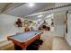 Spacious basement game room with vaulted ceilings and a pool table at 3560 Nc 98, Youngsville, NC 27596