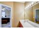 Bathroom featuring a long vanity with double sinks and a large mirror with vanity lights at 3560 Nc 98, Youngsville, NC 27596