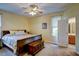 Comfortable bedroom with a large bed, window, and en-suite bathroom, providing a private and relaxing space at 3560 Nc 98, Youngsville, NC 27596