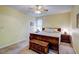 Comfortable bedroom with a large bed, neutral carpet, and ample natural light creates a relaxing atmosphere at 3560 Nc 98, Youngsville, NC 27596