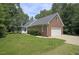 Charming brick home featuring a side entry garage, covered porch, and nicely landscaped yard at 3560 Nc 98, Youngsville, NC 27596