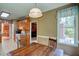 Kitchen with oak cabinets, tile floors, granite countertops and access to back patio at 3560 Nc 98, Youngsville, NC 27596