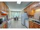 Eat-in kitchen with tile floors, oak cabinets, and granite countertops at 3560 Nc 98, Youngsville, NC 27596
