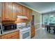 Kitchen with oak cabinets, tile floors, granite countertops and a breakfast nook at 3560 Nc 98, Youngsville, NC 27596