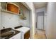 Functional laundry room with modern washer and dryer, built-in shelving, and neutral colors at 3560 Nc 98, Youngsville, NC 27596