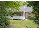 Cozy screened porch attached to a brick home, offering an inviting outdoor living space at 3560 Nc 98, Youngsville, NC 27596