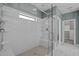 Bright bathroom features glass-enclosed shower with white subway tile and a view of the walk-in closet at 3916 Bostwyck Dr, Fuquay Varina, NC 27526