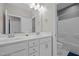 Bright bathroom features a double sink vanity with white cabinetry and a separate shower and tub at 3916 Bostwyck Dr, Fuquay Varina, NC 27526