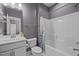Bathroom with grey walls, white sink, toilet, and shower with curtain at 3916 Bostwyck Dr, Fuquay Varina, NC 27526