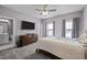 Bedroom with plush carpet, TV, and en-suite bathroom at 3916 Bostwyck Dr, Fuquay Varina, NC 27526