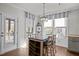 Sunlit breakfast nook with table, seating, and windows overlooking outdoor scenery at 3916 Bostwyck Dr, Fuquay Varina, NC 27526