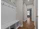 Hallway with hardwood floors and built-in bench, and storage space at 3916 Bostwyck Dr, Fuquay Varina, NC 27526