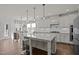 Modern kitchen featuring a large island, stainless steel appliances, and sleek countertops at 3916 Bostwyck Dr, Fuquay Varina, NC 27526