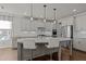 Modern kitchen with stainless steel appliances, a large island, and pendant lighting at 3916 Bostwyck Dr, Fuquay Varina, NC 27526