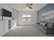Cozy living room features built-in shelving, plush carpeting and plenty of natural light from the window at 3916 Bostwyck Dr, Fuquay Varina, NC 27526