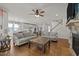 Open concept living room with fireplace, hardwood floors, and staircase in view at 3916 Bostwyck Dr, Fuquay Varina, NC 27526