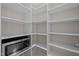 Spacious walk-in pantry with ample shelving for organized storage solutions at 3916 Bostwyck Dr, Fuquay Varina, NC 27526