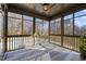 Enclosed screened in porch boasting wooded view and overlooking a sparkling pool at 3916 Bostwyck Dr, Fuquay Varina, NC 27526