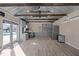 Interior of a versatile shed space, equipped with workspace, cabinets and a refrigerator at 3916 Bostwyck Dr, Fuquay Varina, NC 27526
