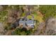 An aerial view of the rear of the house with a back porch and large backyard at 400 Tharps Ln, Raleigh, NC 27614