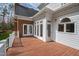 View of the back porch area with white railings, a wood floor, white siding, and entrance to a sun room at 400 Tharps Ln, Raleigh, NC 27614